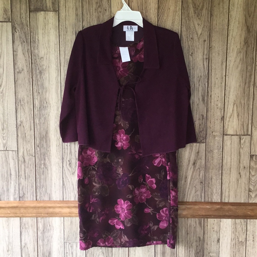 Woman’s two piece maroon colored dress